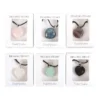 S03723189_13.webp Set of 24 Healing Heart Crystal Necklaces in Display