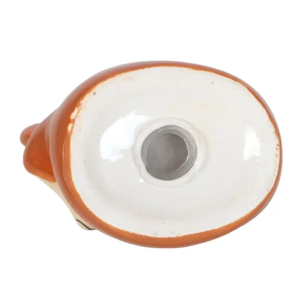 Ceramic Figurine Base White And Terracotta Glaze With Hole White and orange glazed ceramic figurine base with central hole and glossy oval underside.