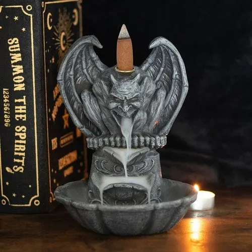 Gargoyle Incense Burner Gray Stone - Backflow Smoke Feature A gray stone gargoyle incense burner with flowing smoke beside a lit candle and occult book.