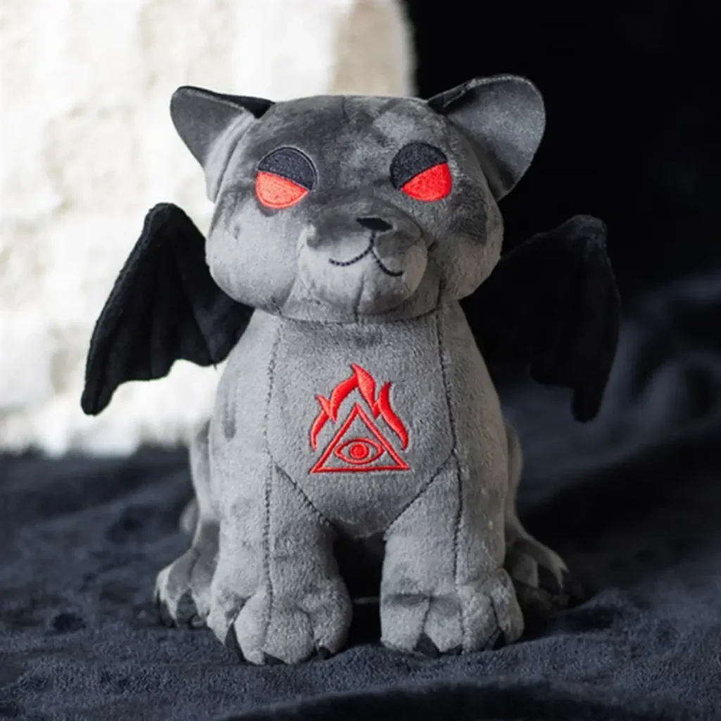 Gothic Friends - What Gothic Gifts Suit Best? 8 Gothic gifts for gothic friends A gray cat-gargoyle plush with red eyes, black bat wings, and an embroidered red symbol.