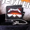 Metallica Master of Puppets Leather Wallet - Silver Chain Metallica Master of Puppets wallet with silver chain and black leather strap on textured background.
