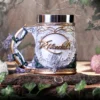 Rivendell Elven Ceramic Mug Gold and Green - Vine Handle Design An ornate elven-style Rivendell mug with gold filigree and vine-shaped handle on a wooden surface.