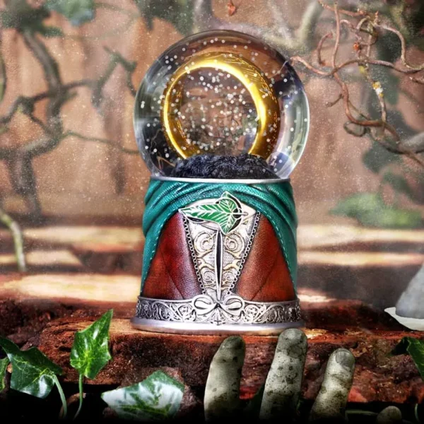 Fantasy Snow Globe Silver Green Base - Glowing Golden Ring A fantasy snow globe with a glowing golden ring on an ornate silver and green base.