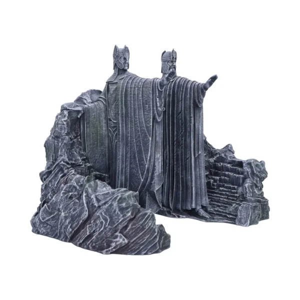 Two massive stone statues of robed kings carved into a rocky cliffside.