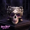 Gothic Skull Sculpture Purple Resin - Spiderweb Eyes and Glow A gothic skull with purple spiderweb eyes, twin buns, and glowing purple teeth on a stone pedestal.