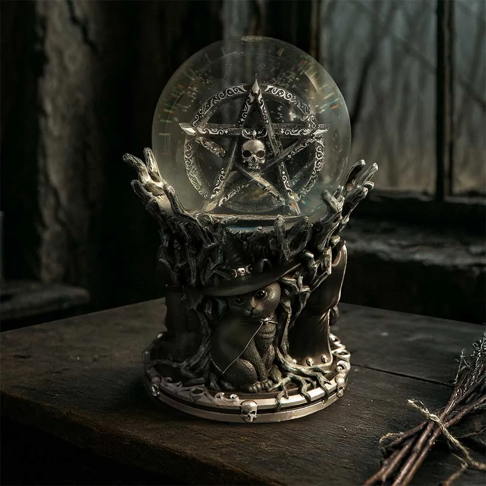 A mystical crystal ball with a pentagram and skull on a wooden table with a witch cat.
