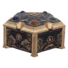 Ornate Gold and Black Jewelry Box - Gemstone Engraved Lid An ornate gold and black decorative box with engraved patterns and colorful gemstone accents.