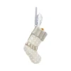 Cream Christmas Stocking Ornament - Embossed Silver Detailing A cream and silver Christmas stocking ornament with embossed patterns hanging by a gray ribbon.