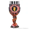 Dark fantasy chalice with fiery core, twisted metal stem, and pink flowers at the base.
