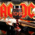AC/DC collectables black and red metal goblet with guitar and lightning logo background