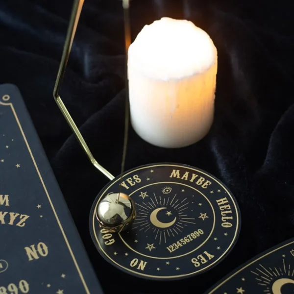 Brass Pendulum Divination Board Black Gold - Celestial Design Black and gold celestial pendulum divination board with candle for spiritual readings.