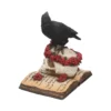 Gothic Crow Skull Sculpture Resin Black With Red Roses and Book A black crow on a human skull with red roses resting atop an open antique book.
