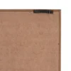 MDF Wall Frame Light Brown Back Corner With Sawtooth Hanger Back corner of a light brown MDF picture frame with a black sawtooth wall hanger.