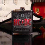 AC/DC Black Ice stainless steel hip flask with embossed red logo and reflective metal finish.