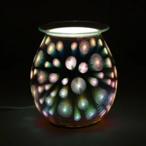 3D Glass Electric Aroma Lamp Multicolor - Firework Design Tealights vs electric burners: Colourful 3D glass electric aroma lamp glowing with starburst light patterns on a dark background.