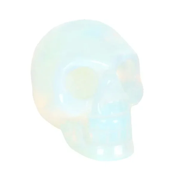 A small polished opalite skull sculpture shimmering with blue, pink, and yellow iridescent hues.