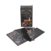 A Tarot Familiars deck with illustrated cat-themed tarot cards and a mystical candlelit box.