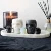 Set of 12 Opium & White Sage Skull Candles in Display 12 Set of 12 Opium & White Sage Skull Candles in Display