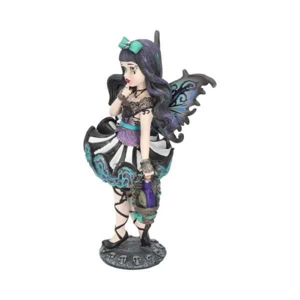 A gothic fairy figurine with bat-like wings holding a lantern on a skull-decorated base.