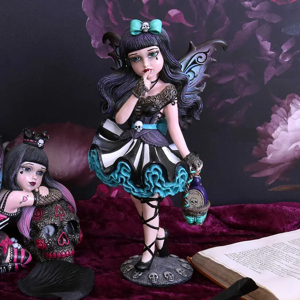 A Smart Guide to Licensed Gifts Buying 5 Licensed Gifts Buying. A gothic fairy figurine holding a poison bottle beside another dark fantasy doll and open spellbook.