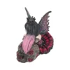 Gothic Fairy Figurine Resin Sculpture - Black And Pink Wings A gothic fairy figurine with black and pink hair sitting on a decorated skull with rose details.