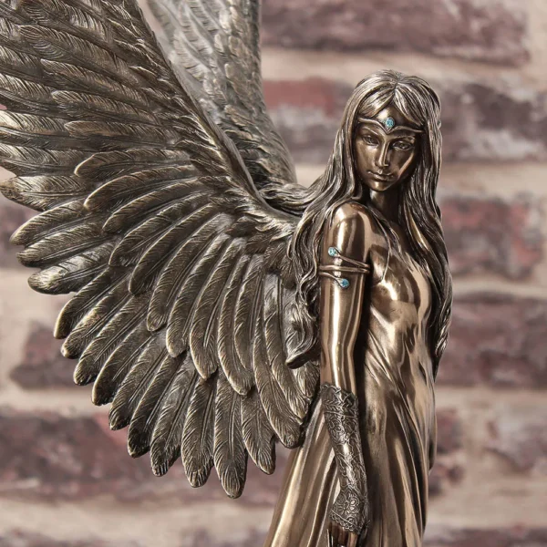 Bronze Angel Statue - Elegant Wings and Blue Gem Accents A bronze statue of a female angel with detailed wings, blue gemstones, and flowing hair.