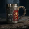 Game of Thrones Metal Mug Silver and Gold House Sigils Design A detailed metal Game of Thrones mug featuring House Stark and House Lannister emblems.