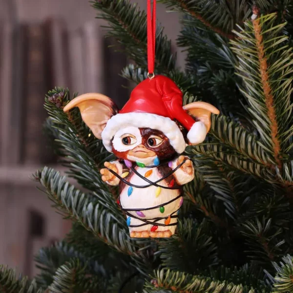 Gizmo Christmas Ornament Resin Figure - Tangled Colorful Lights Gizmo Christmas ornament tangled in colorful lights hanging on a green tree branch The-Hidden-Hatch