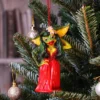 Greta Gremlin Christmas Ornament Red Gown - Festive Tree Décor Greta Gremlin Christmas ornament hanging on a decorated tree with festive lights and baubles. The-Hidden-Hatch