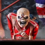 Licensed Gifts buying. Iron Maiden The Trooper Undead soldier in red military uniform snarling before a tattered British flag on a smoky battlefield.