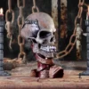 Metallica Skull Sculpture Resin Gothic Brown - Candles And Chains A gothic skull sculpture with Metallica logo, lit candles, and rusted chains in smoky darkness.
