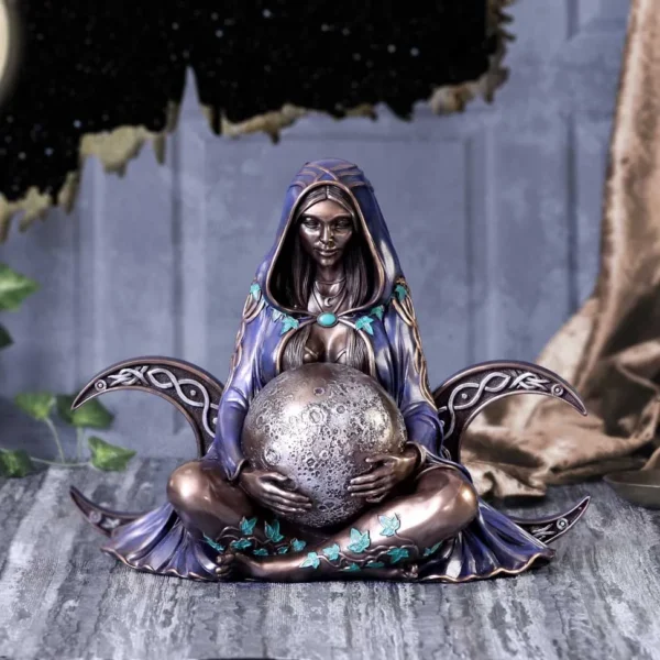 Moon Goddess Figurine Resin Statue Purple Cloak With Lunar Orb Mystical moon goddess figurine in purple cloak holding lunar orb with gold and turquoise details.