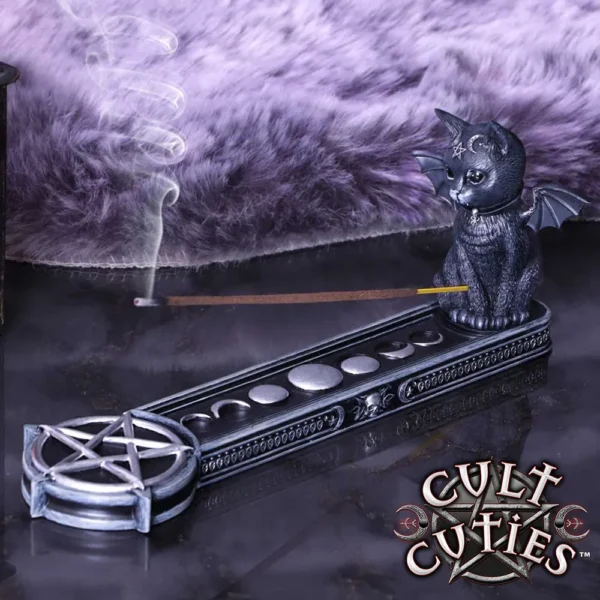 Black Winged Cat Incense Holder - Gothic Lunar Phases Design Black winged cat incense holder with lunar phases and pentagram on reflective surface.