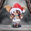 Gizmo Mogwai Figurine Resin Brown Santa Hat With Christmas Lights Gizmo figurine wearing a Santa hat tangled in colorful Christmas lights on display. The-Hidden-Hatch