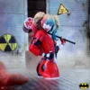 A detailed Harley Quinn statue with red and black outfit, mallet, and industrial background.