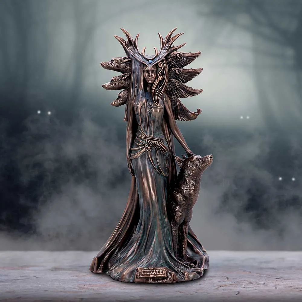 Bronze statue of Hecate with loyal hound in a misty forest background.