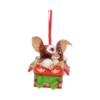 Gizmo Christmas Ornament Figurine Red Gift Box With Green Bow Gizmo Christmas ornament popping from a red and gold gift box with green bow The-Hidden-Hatch
