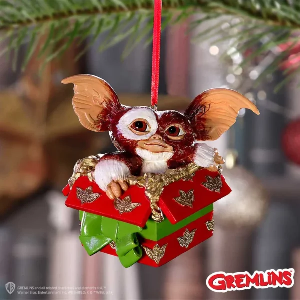 Gizmo Christmas Ornament Resin Red Green Gift Box - Festive Charm Licensed Gifts Buying Gizmo Christmas ornament in red and green gift box hanging on a tree branch The-Hidden-Hatch