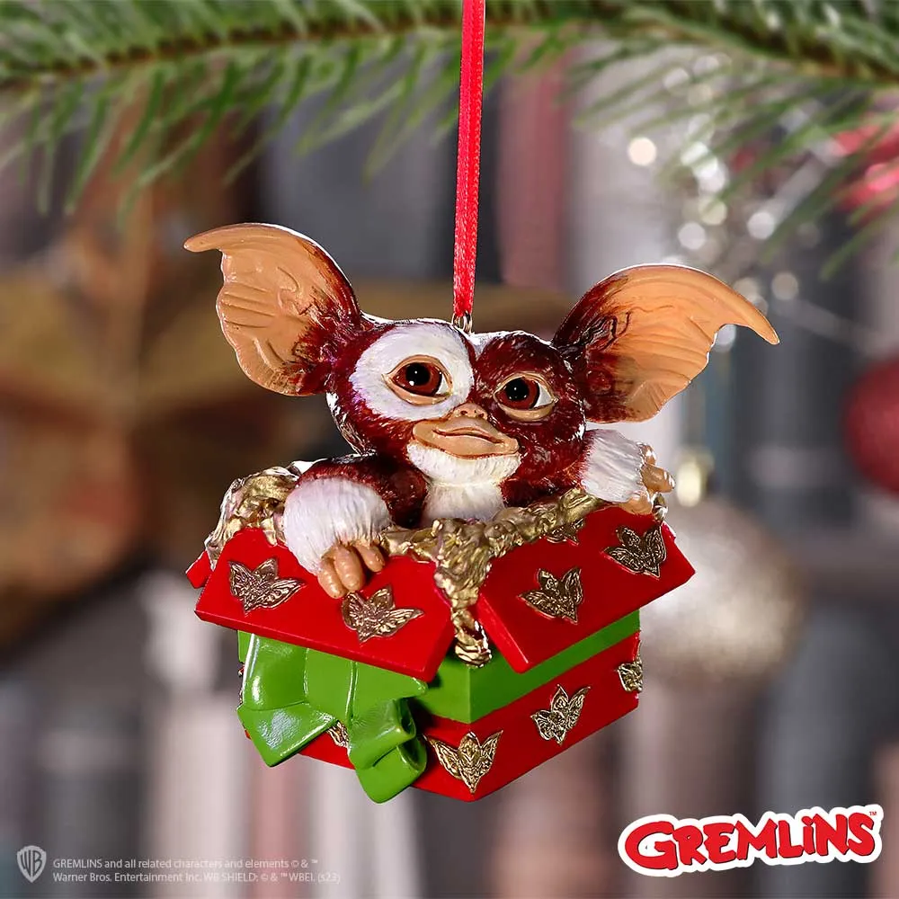 A Smart Guide to Licensed Gifts Buying 2 Licensed Gifts Buying Gizmo Christmas ornament in red and green gift box hanging on a tree branch The-Hidden-Hatch