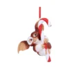 Gizmo Christmas ornament hugging a red-and-white candy cane with ribbon holiday decor The-Hidden-Hatch
