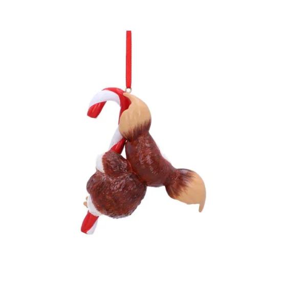 A brown squirrel ornament clinging to a red and white candy cane for Christmas decor The-Hidden-Hatch