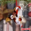 Gizmo Christmas Ornament Figurine Red Candy Cane Design Gizmo Christmas ornament hugging a red and white candy cane on a tree branch The-Hidden-Hatch