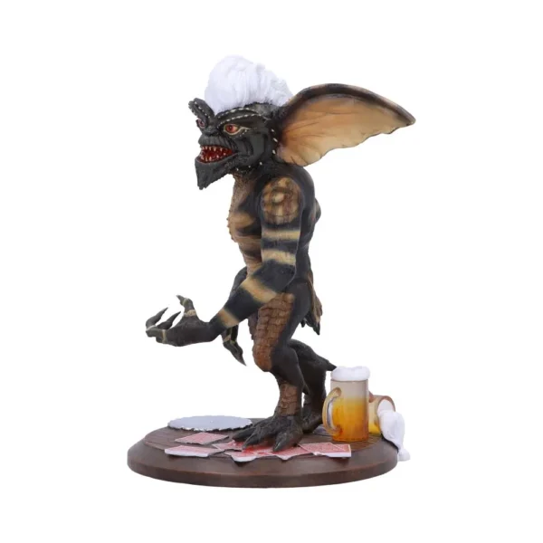 Gremlin Figurine Collectible Brown Resin With White Hair Crest Gremlin figurine with white hair crest holding playing cards and beer on wooden base The-Hidden-Hatch