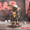 Stripe Gremlin Collectible Figurine - Dark Scaly Finish Base Stripe Gremlin figurine standing on a gaming-themed base with bar background. The-Hidden-Hatch
