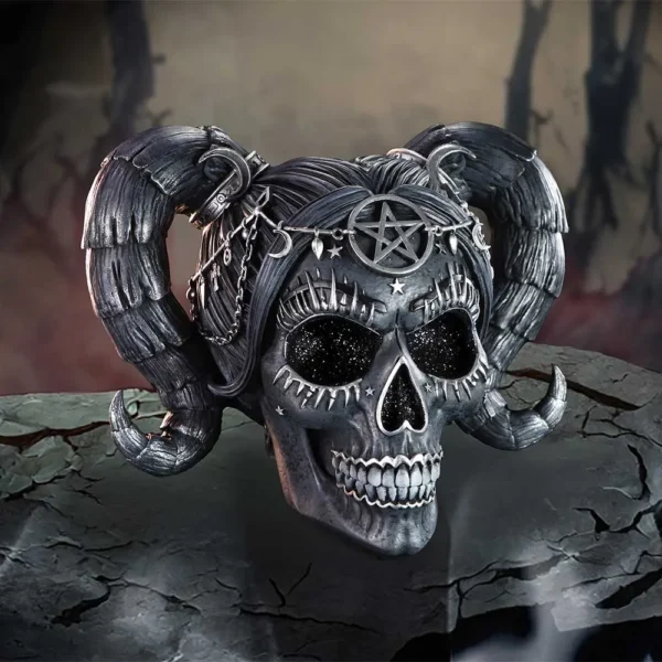 Cosmic Skull Sculpture Dark Gray Resin With Ram Horns Dark gray skull with galaxy eyes, ram horns, and occult symbols on a misty altar background.