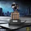 A detailed miniature Bat-Signal model above a Gothic Gotham City building with DC branding.