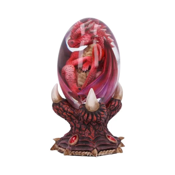 A red dragon curled inside a clear glass egg held by a dark clawed base.