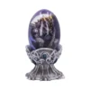 Dragon Egg Sculpture Glass Resin Purple Blue - Celtic Stand Design A purple dragon curled inside a translucent blue egg on an ornate Celtic-patterned stand.