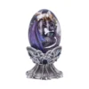 Purple Dragon Glass Egg Ornament - Silver Celtic Stand A purple dragon curled inside a glass egg on a silver Celtic stand with blue gems.