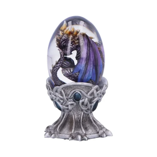 A purple and bronze dragon curled inside a transparent decorative egg on an ornate metallic stand.